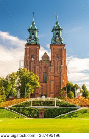Landscape View Of Royal Gniezno Cathedral. Basilica Of The Assumption Of Blessed Virgin Mary And St.
