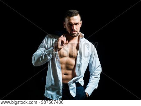 Man Undressed Shirt. Sexy Man With Muscular Body And Bare Torso