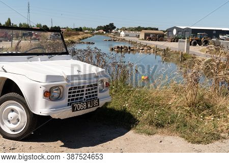 Noirmoutier , Vendée / France - 08 16 2020 : Citroen Mehari Ancient Beach Car White Convertible Vehi