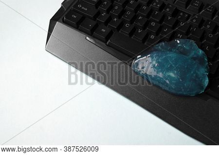 Blue Soft Gel Cleaning Dust On Keyboard. Concept Cleaning Your Computers Keyboard. Office Cleaning.