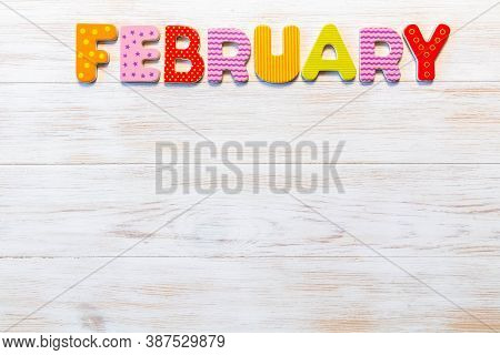 Wooden Letters Written February Month On Vintage Background. Inscription January With Copy Space. To