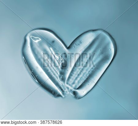 Transparent gel with bubbles close-up. Smear of face gel cream. The texture of gel cream. A sample of a cosmetic product. Antibacterial gel.