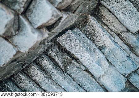 Natural Stone Texture. Basalt Lava Formations Like Columns. Icelandic Typical Natural Background. Vo