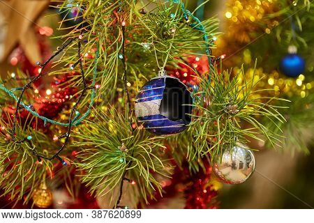 Detail Of Christmas Tree With A Broken Blue Glass Ball