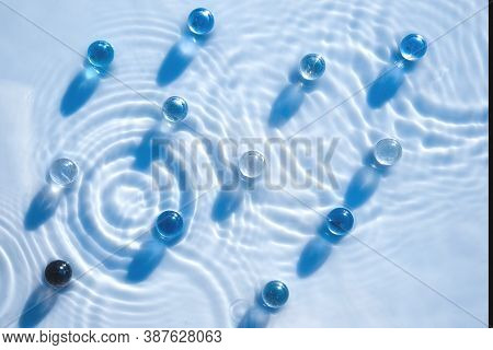 Cosmetic Moisturizing Emulsion With Granules, Serum Or Gel In Blue Color, Abstract Background For Co