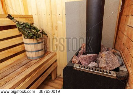 Interior Details Finnish Sauna Steam Room With Traditional Sauna Accessories Basin Birch Broom. Trad