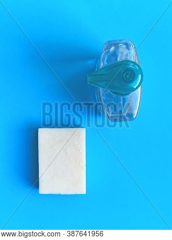 White Hand Soap And Disinfectant Gel On A Blue Backround