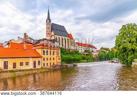 St Vitus Church In The Middle Of Historical City Centre. View From Vltava River. Cesky Krumlov, Sout