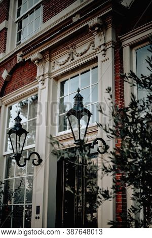 Black Screw Lights On The Facade Of An Orange Building