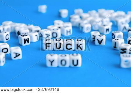 The Inscription Fuck You Made Up Of Cubes On A Blue Background