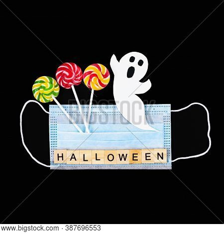 Cut Out Paper Ghost, Colorful Lollipops, Medical Mask And Word Halloween On Black. Halloween Backgro