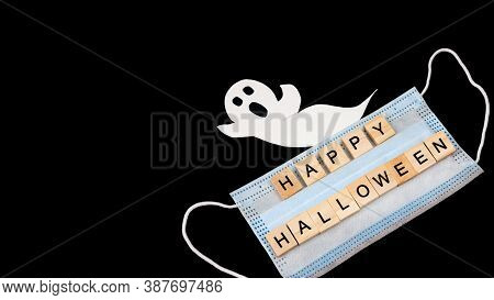 Cut Out Paper Ghost, Medical Mask And Words Happy Halloween On Black. Halloween Background Decor Hol
