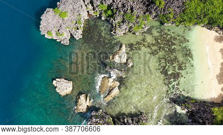 Tropical Beach With Tourists Surrounded By Blue Water, Aerial View. Lahos Island, Caramoan Islands, 