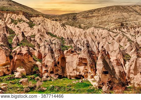 Zelve, Cappadocia, Central Anatolia. Rock Formations And Houses In The Mountain. Turkey
