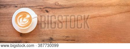 Banner Made From Cappuccino With Frothy Foam, White Coffee Cup Top View Closeup On Wooden Background