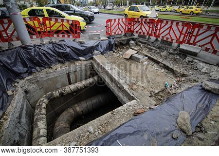 Bucharest, Romania - October 1, 2020: Hole In The Ground Made By The City Hall Workers To Change Hot