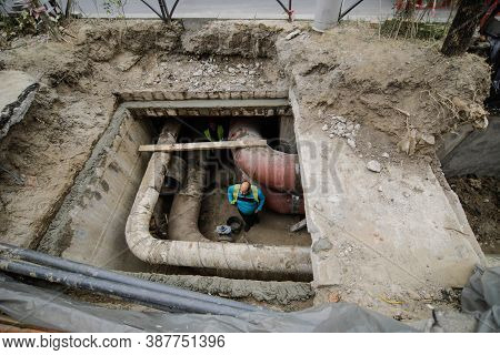 Bucharest, Romania - October 1, 2020: Hole In The Ground Made By The City Hall Workers To Change Hot