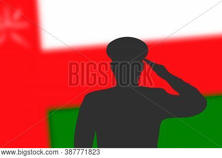 Solder Silhouette On Blur Background With Oman Flag.