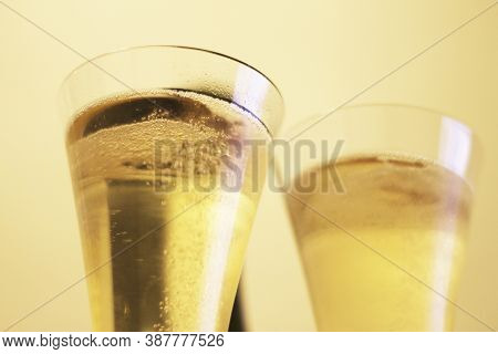 Bottle Of Shampagne And A Two Full Glasses Of Shamoagne Before Drinking Closeup Isolated