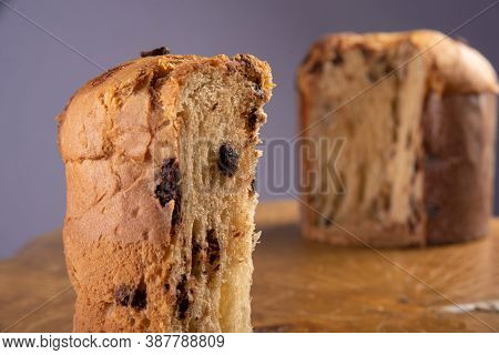 Panettone With Chocolate Chips On Rustic Wood With Gray Background, Selective Focus.