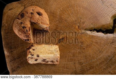 Panettone With Chocolate Chips On Rustic Wood, Top View
