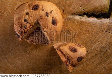 Panettone With Chocolate Chips On Rustic Wood, Top View