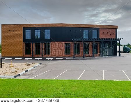 New Modern Office House With Parking Lots In Front Of Building. Big Contemporary House With Brick, W