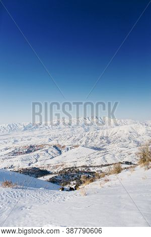 Beautiful Panoramic View Of Snow Covered Mountains. The Best View From The Beldersay Cable-way