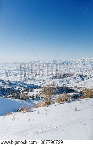 Picturesque Tien Shan Mountains In Uzbekistan, Covered With Snow, Winter Clear Sunny Day In The Moun