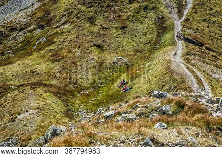 Resting Tourists And Stoned Heart Western Tatras Mountains, Slovak Republic. Hiking Theme. Seasonal 