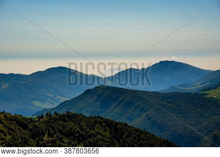 The Peaks Of The Alps Around Lake Garda Surrounded By Fog With Blue Sky Seen From Monte Altissimo, T