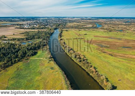Chachersk, Belarus. Aerial View Green Meadows And Sozh River Landscape In Sunny Summer Day. Top View