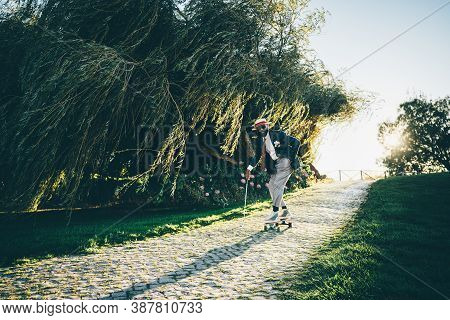 A Fancy Handsome Black Man In A Hat, Elegant Suit With Trousers And Necktie, With A Golf Club In His