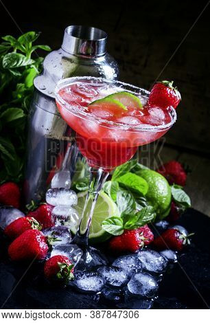 Alcoholic Cocktail With Strawberry, Lime And Ice, Black Background, Selective Focus