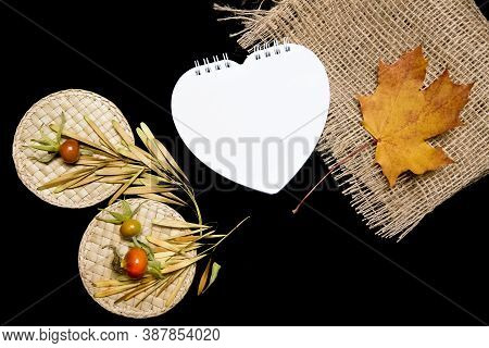 Mockup Scene. Blank Heart-shaped Paper, Maple Leaves, Dry Seeds, Straw And Rose Hips On Black Backgr