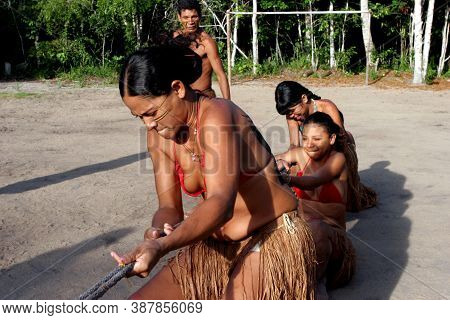 Porto Seguro, Bahia / Brazil - April 13, 2006: Pataxo Indians Are Seen In The Jaqueira Village In Th