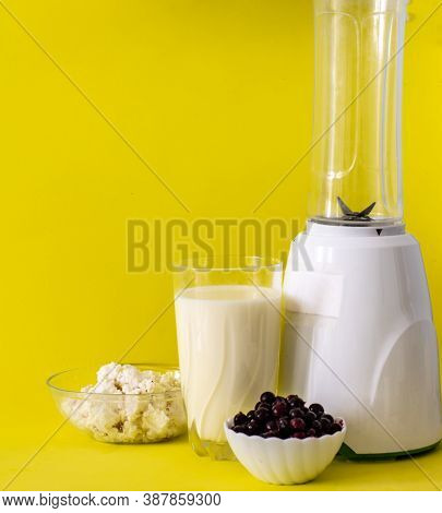 Smoothie With Cottage Cheese And Fresh Berries On A Solid Yellow Background