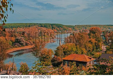 Old Iron Suspension Bridge. Pedestrian Bridge Across The Sylva River On A Sunny Day In Kungur, Perm 