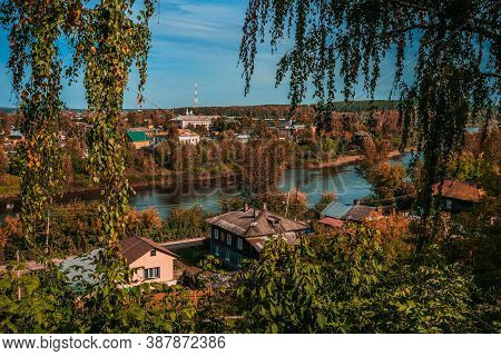 Autumn Nature Of Perm Krai. Kungur Cityscape With Houses And The Sylva River On A Sunny Day.