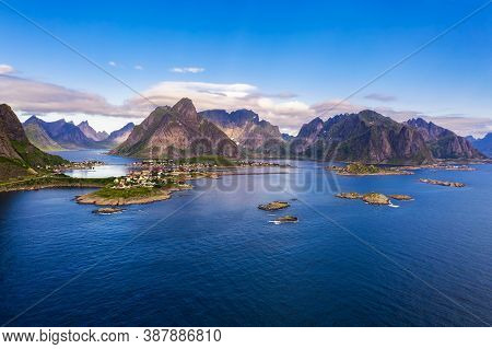 Aerial View Of Reine Fishing Village Surrounded By High Mountains On Lofoten Islands In Norway.