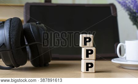 Ppp(point-to-point Protocol) -acronum On Cubes On The Background Of The Tablet, Headphones And A Whi