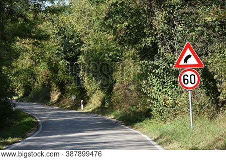 Road Signs That Shows Maximum Speed Of 40 Kilometers Per Hour And Signa That Warns Drivers On Sharp 