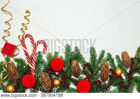 Christmas Composition. Red Decorations On A White Wall. Winter, New Year's Concept. Flat Layout, Iso