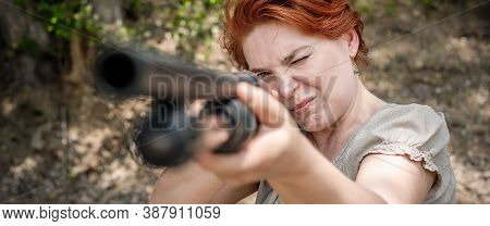 Woman Shooting With Pump Gun. Shotgun Front View Gun Point