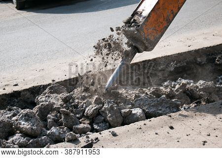 Construction Of A New Multi-storey Building. The Work Of A Jackhammer When Laying The Foundation.