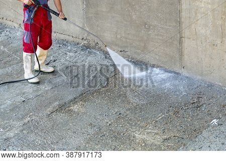 Outdoor Dirty Concrete Cleaning With High Pressure Water Jet.
