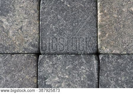 Stone Dark Textured Background Close-up. Natural Gray Backdrop Or Wallpaper. Rough Shabby Surface. S