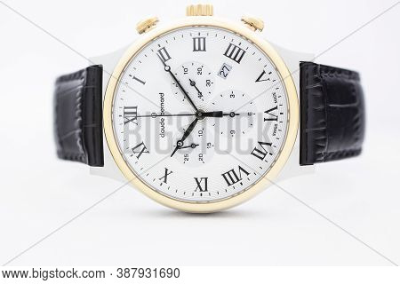 Geneve, Switzerland 01.10.2020 - Claude Bernard Man Swiss Made Watch Gold Pvd Coating White Dial Lea