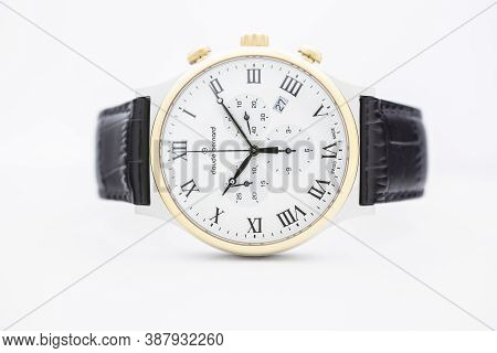 Geneve, Switzerland 01.10.2020 - Claude Bernard Man Swiss Made Watch Gold Pvd Coating White Dial Lea