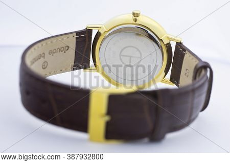 Geneve, Switzerland 01.10.2020 - Claude Bernard Swiss Made Watch Gold Pvd Coating Back Case Leather 